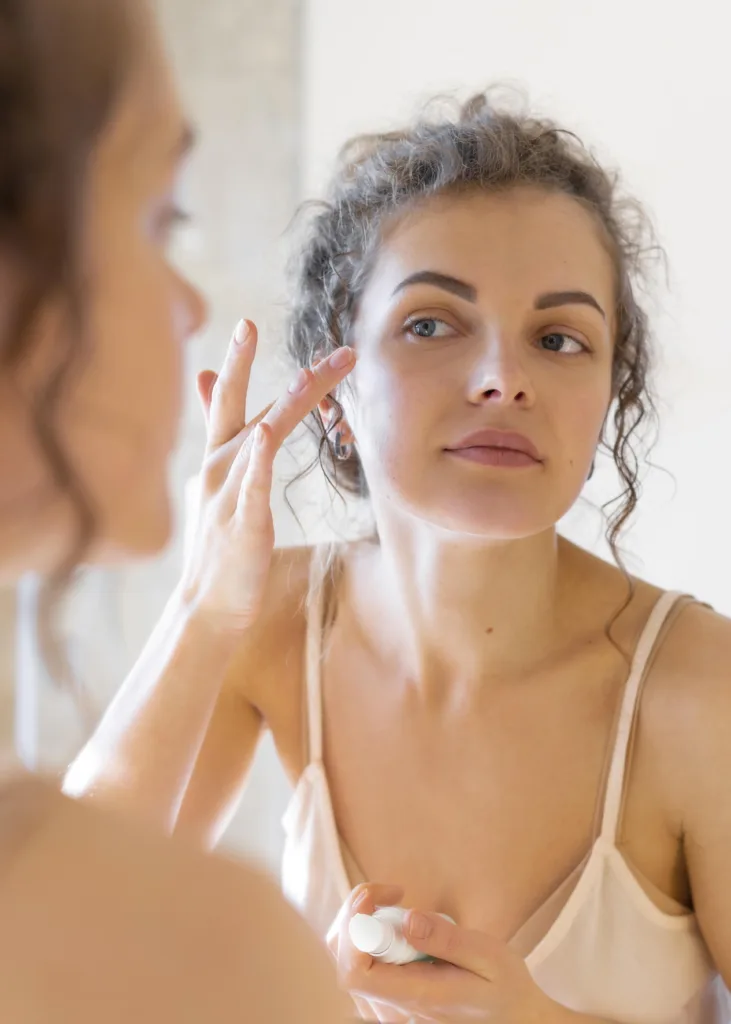 Woman Looking Mirror Applying Cream Face 731x1024